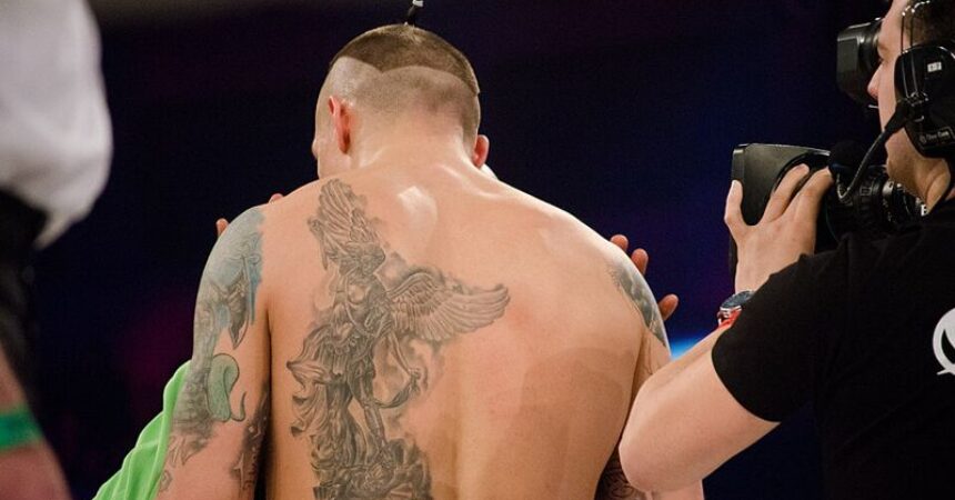 oleksandr usyk in boxing ring pictured from behind