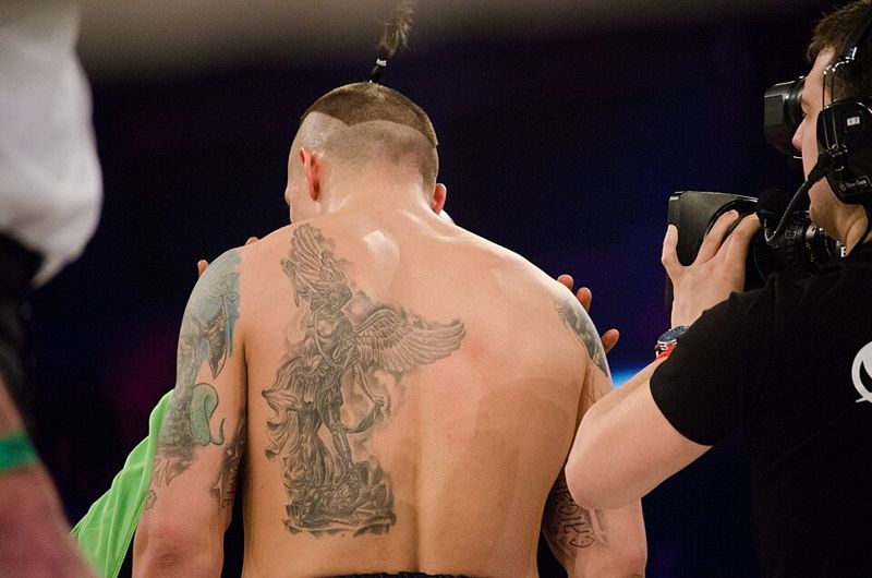 oleksandr usyk in boxing ring pictured from behind