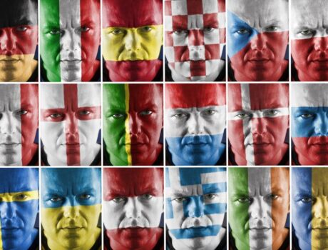 faces painted in different national flags