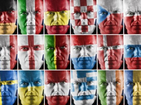 faces painted in different national flags